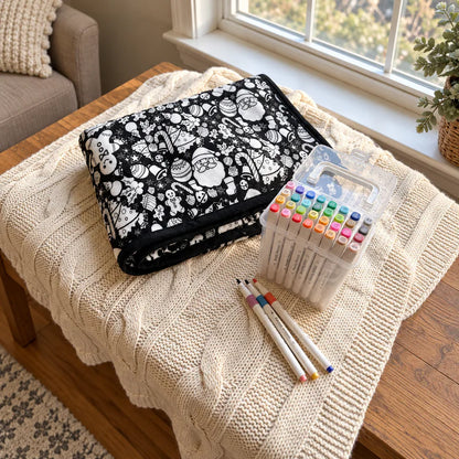 Folded Christmas coloring blanket and markers